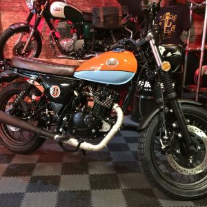 Mash Seventy 125cc in Gulf style at Chas Mann Motorcycles rectangle side view