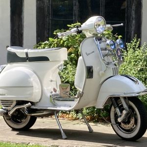 Vespa PC 125cc in white called Lola side stand side view
